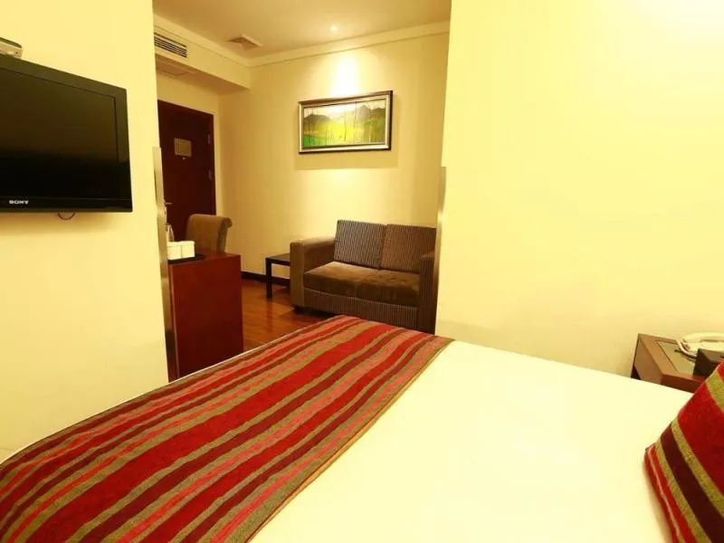 Bed in GreenTree Inn Jiangsu Nantong Qidong Middle Heping Road Business Hotel