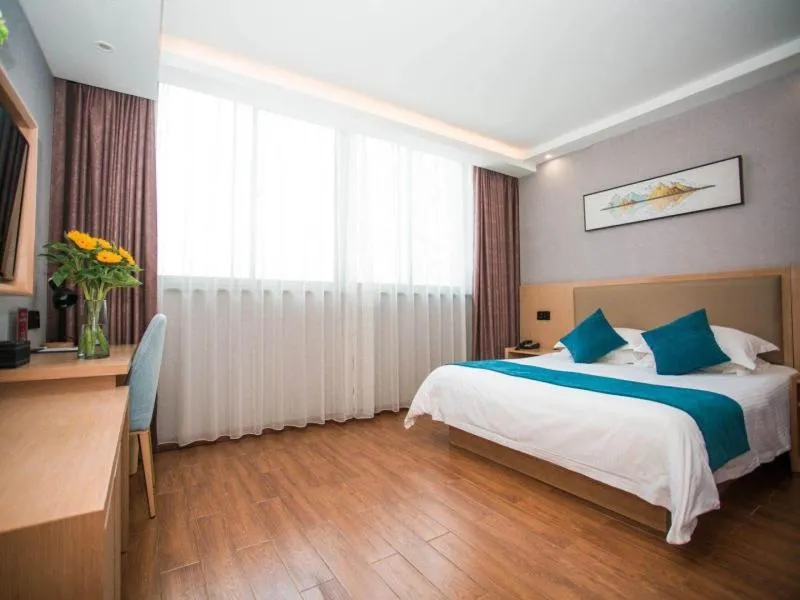 Bed in GreenTree Inn Nantong Hai'an Mingzhu City Express Hotel