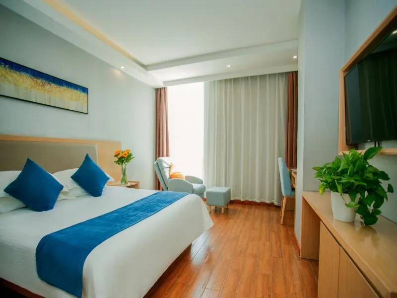 Bed in GreenTree Inn Nantong Hai'an Mingzhu City Express Hotel