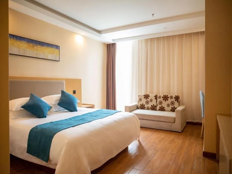 Bed in GreenTree Inn Nantong Hai'an Mingzhu City Express Hotel