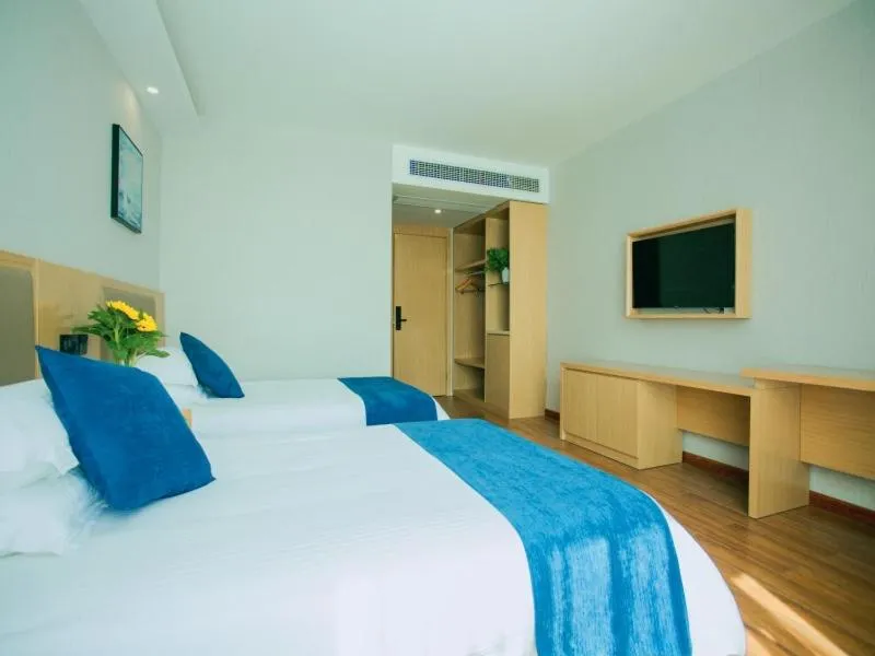 Bed in GreenTree Inn Nantong Hai'an Mingzhu City Express Hotel