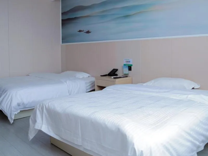Bed in GreenTree Inn Jiangsu Yangzhou West Passenger Station Baixiang Road Express Hotel