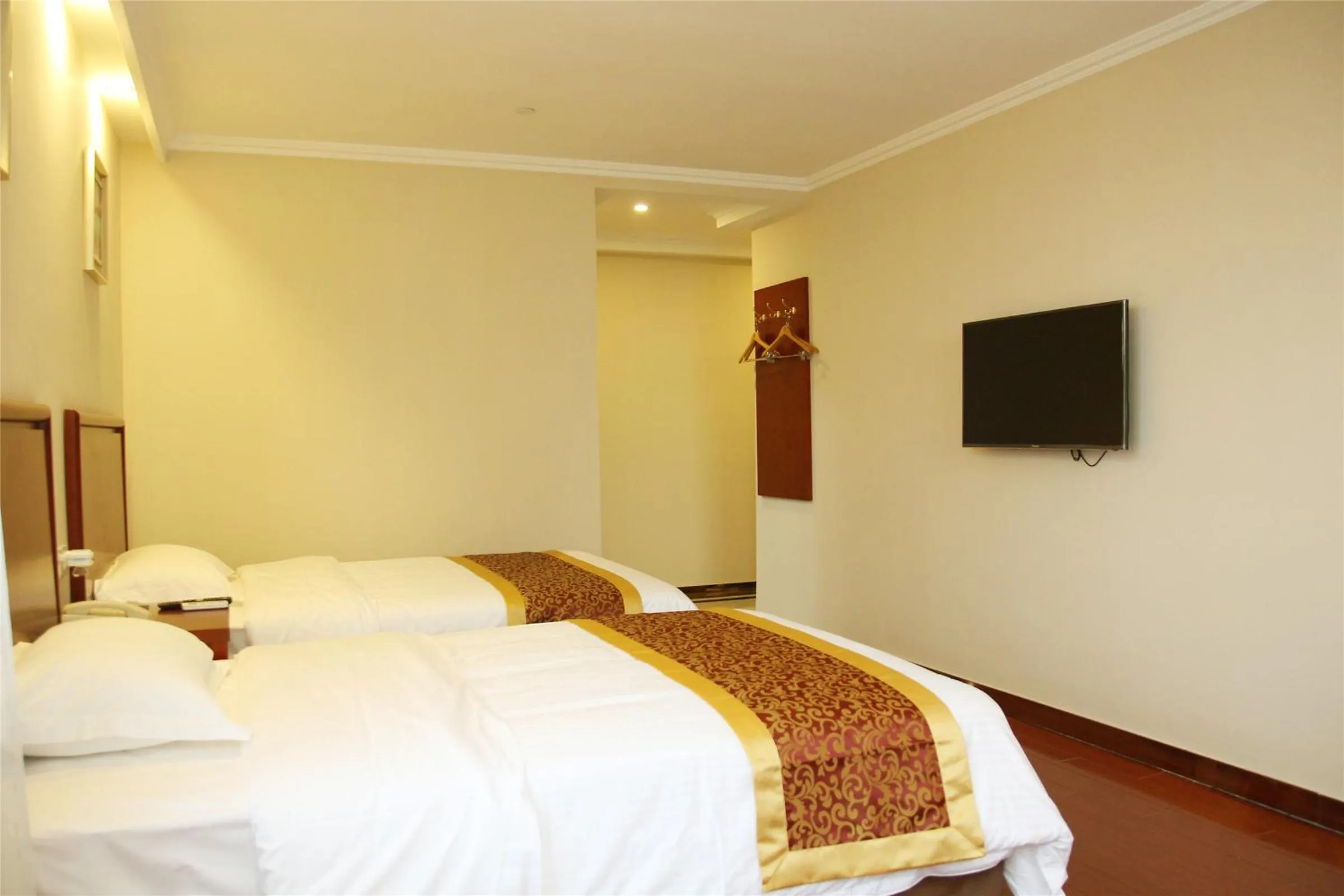 Bedroom in GreenTree Inn Jiangsu Yancheng Dongtai Railway Station Beihai East Road Express Hotel