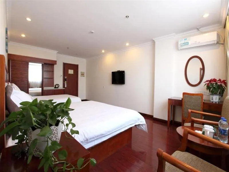 Bed in GreenTree Inn Jiangsu Taizhou Taidong Railway Station Business Hotel