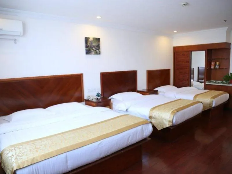 Bed in GreenTree Inn Jiangsu Taizhou Taidong Railway Station Business Hotel