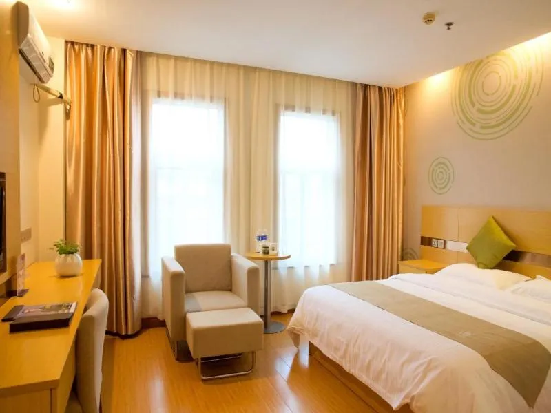 Bed in GreenTree Inn Zhejiang Shaoxing Xinchang Buddha Express Hotel