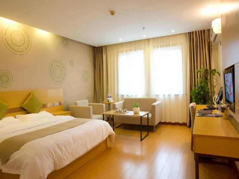 Bed in GreenTree Inn Zhejiang Shaoxing Xinchang Buddha Express Hotel