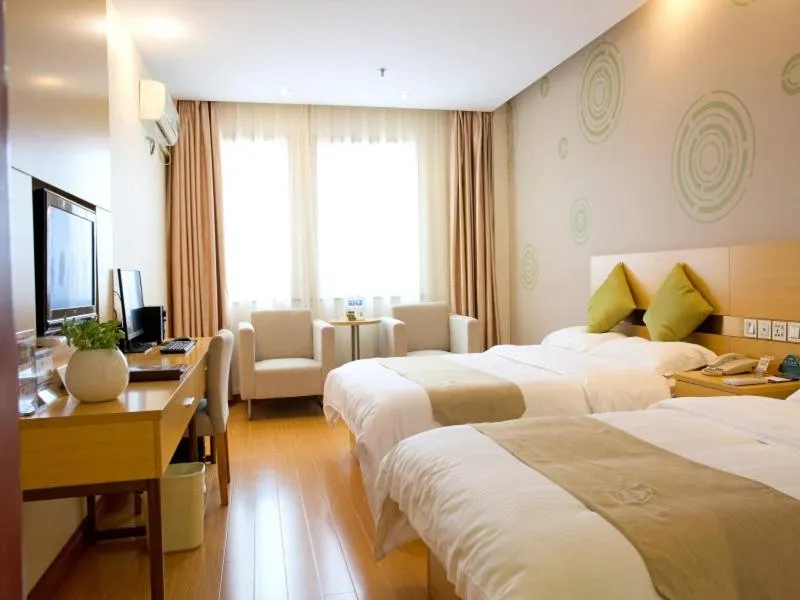 Bed in GreenTree Inn Zhejiang Shaoxing Xinchang Buddha Express Hotel