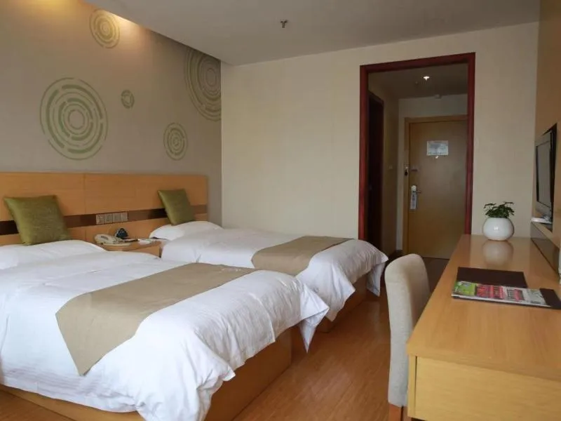 Bed in GreenTree Inn Zhejiang Shaoxing Xinchang Buddha Express Hotel