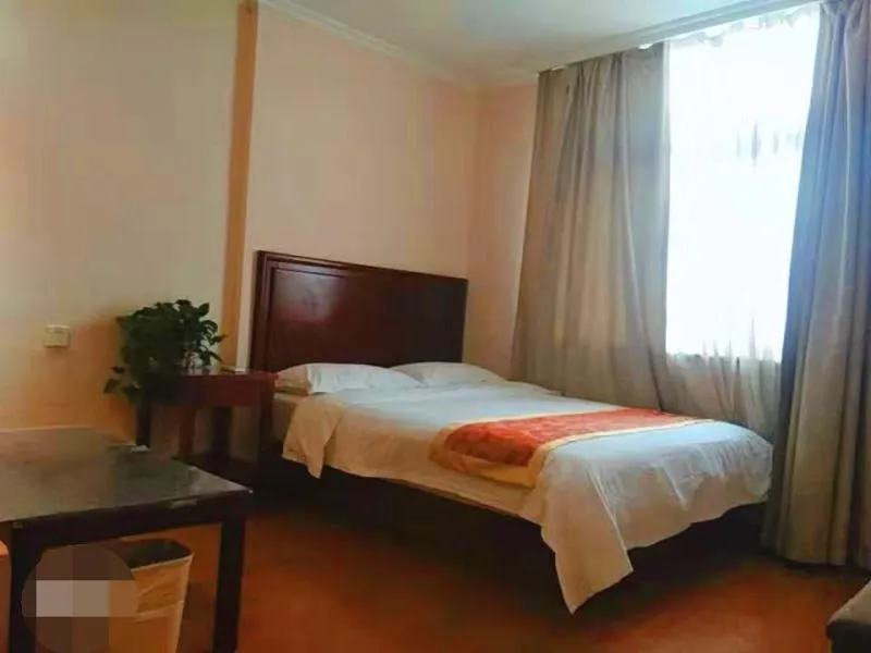 Bed in GreenTree Inn Shandong Jining Zoucheng South Yishan Road Experimental Middle School Express Hotel