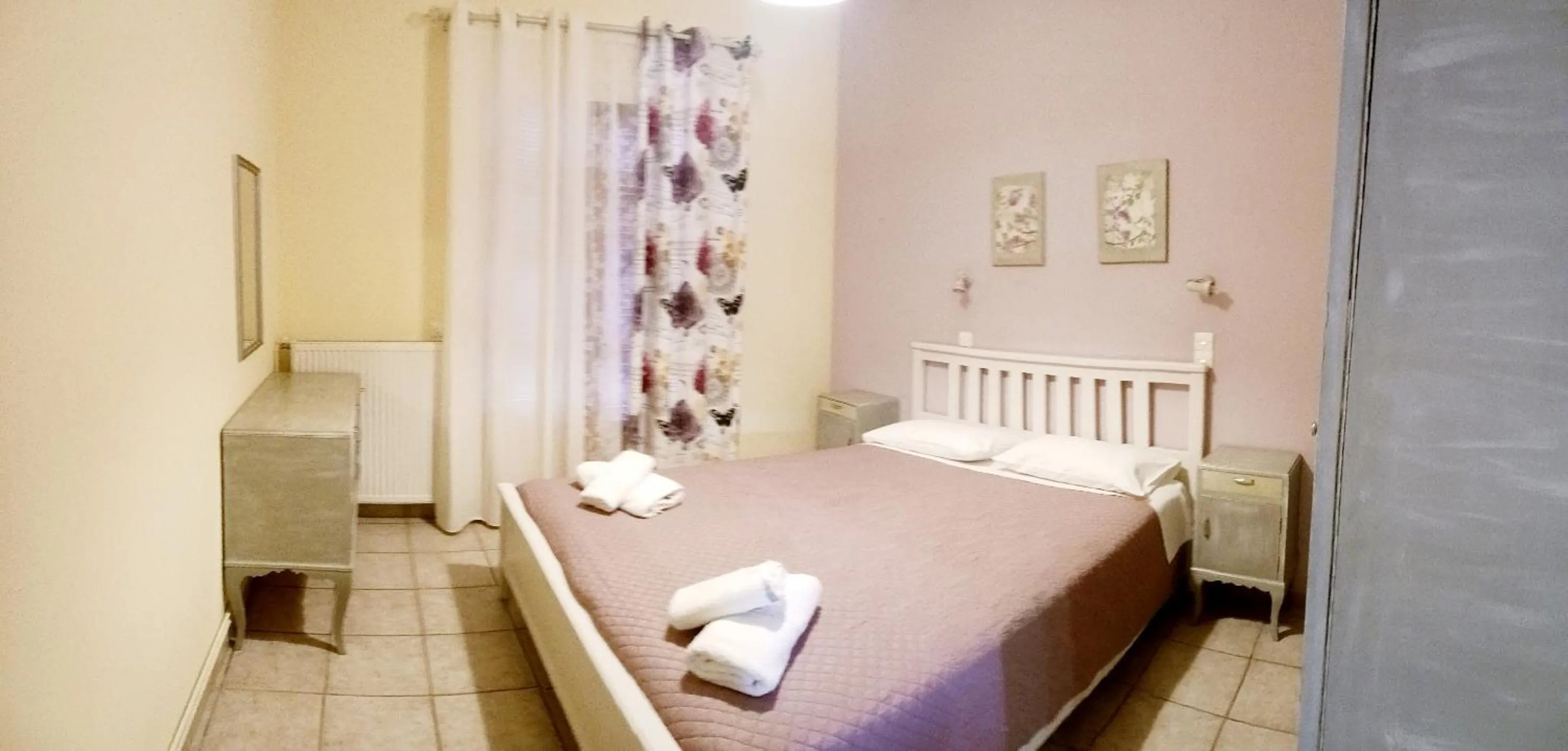 Bed in Olga's Garden Apartments
