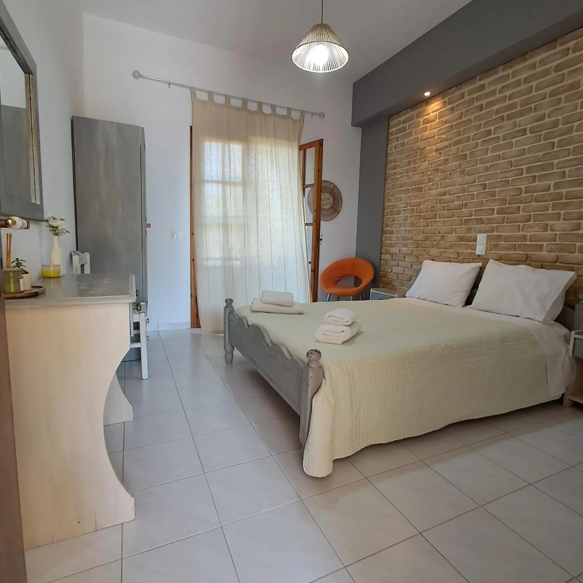 Bed in Olga's Garden Apartments
