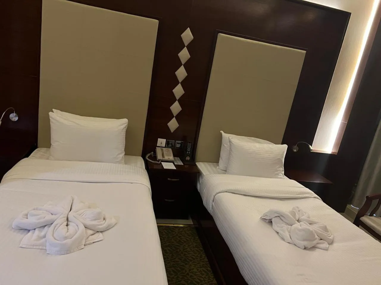 Bed in Queen Palace Hotel