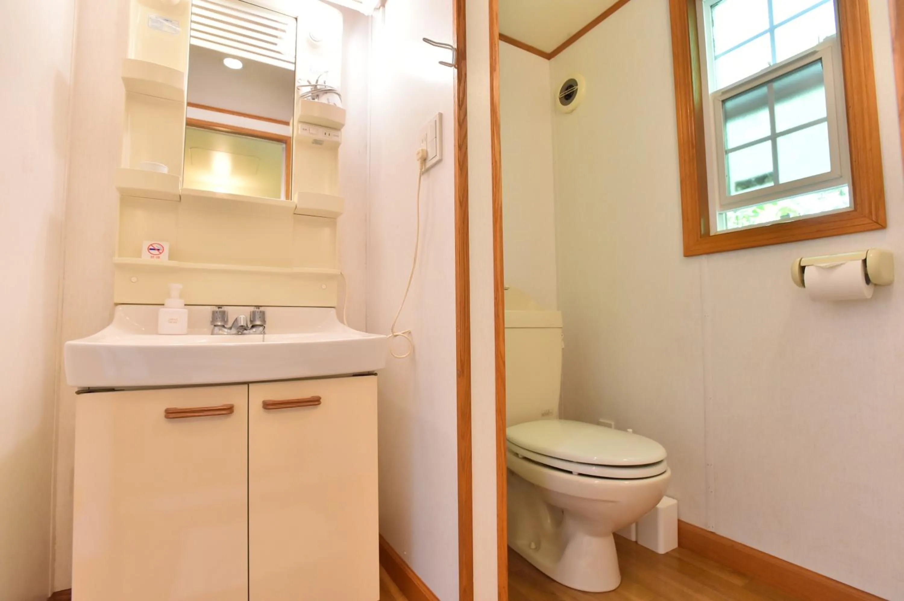 Toilet in PANORAMA Ocean View Cottage
