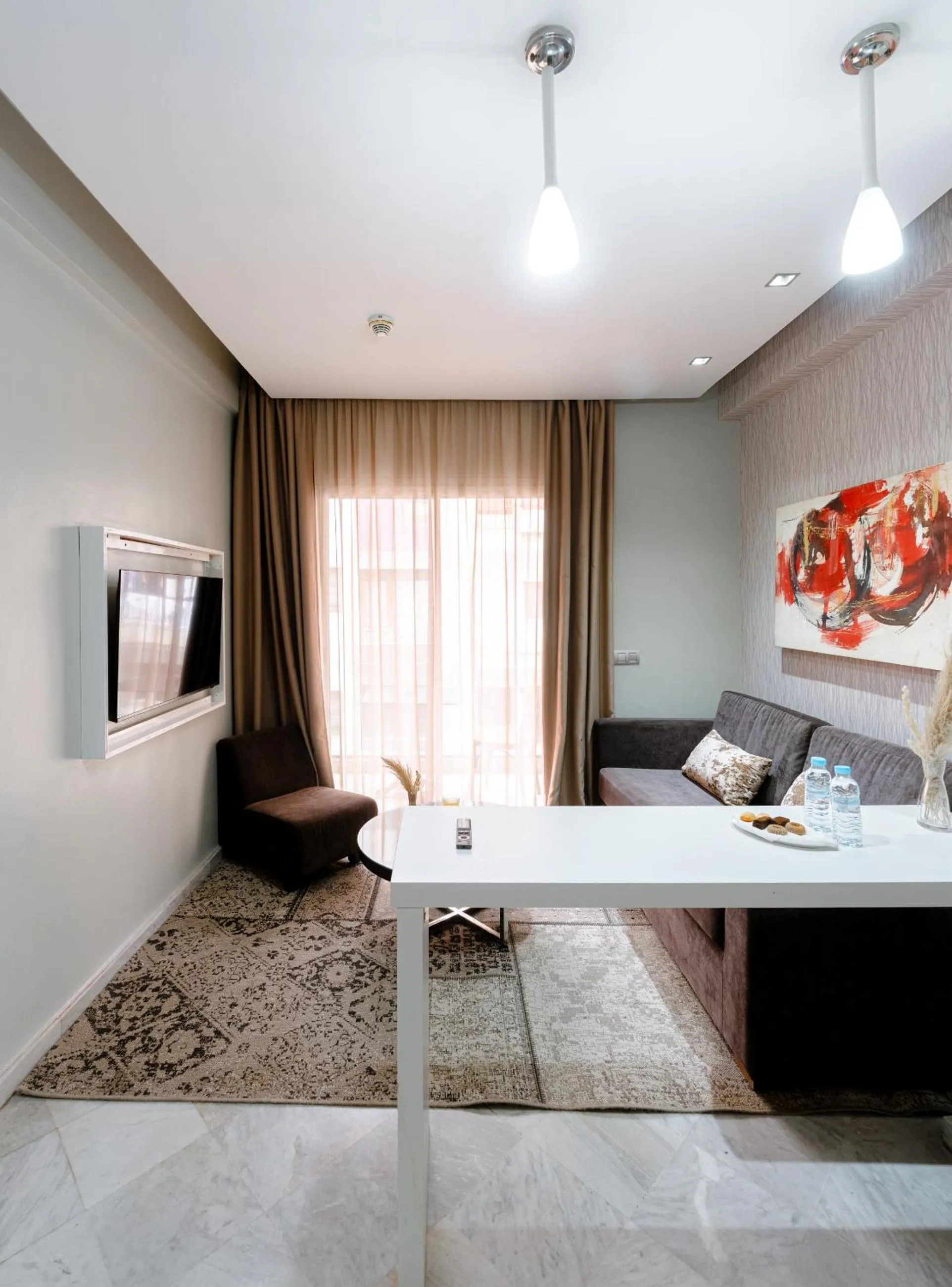 Communal lounge/ TV room in The Fourteen Luxury Boutique Hotel