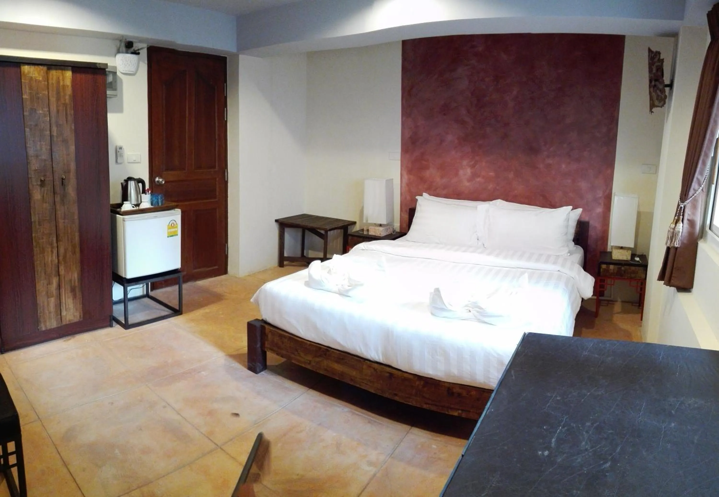 Bed in Arcadia Maephim Serviced Apartments