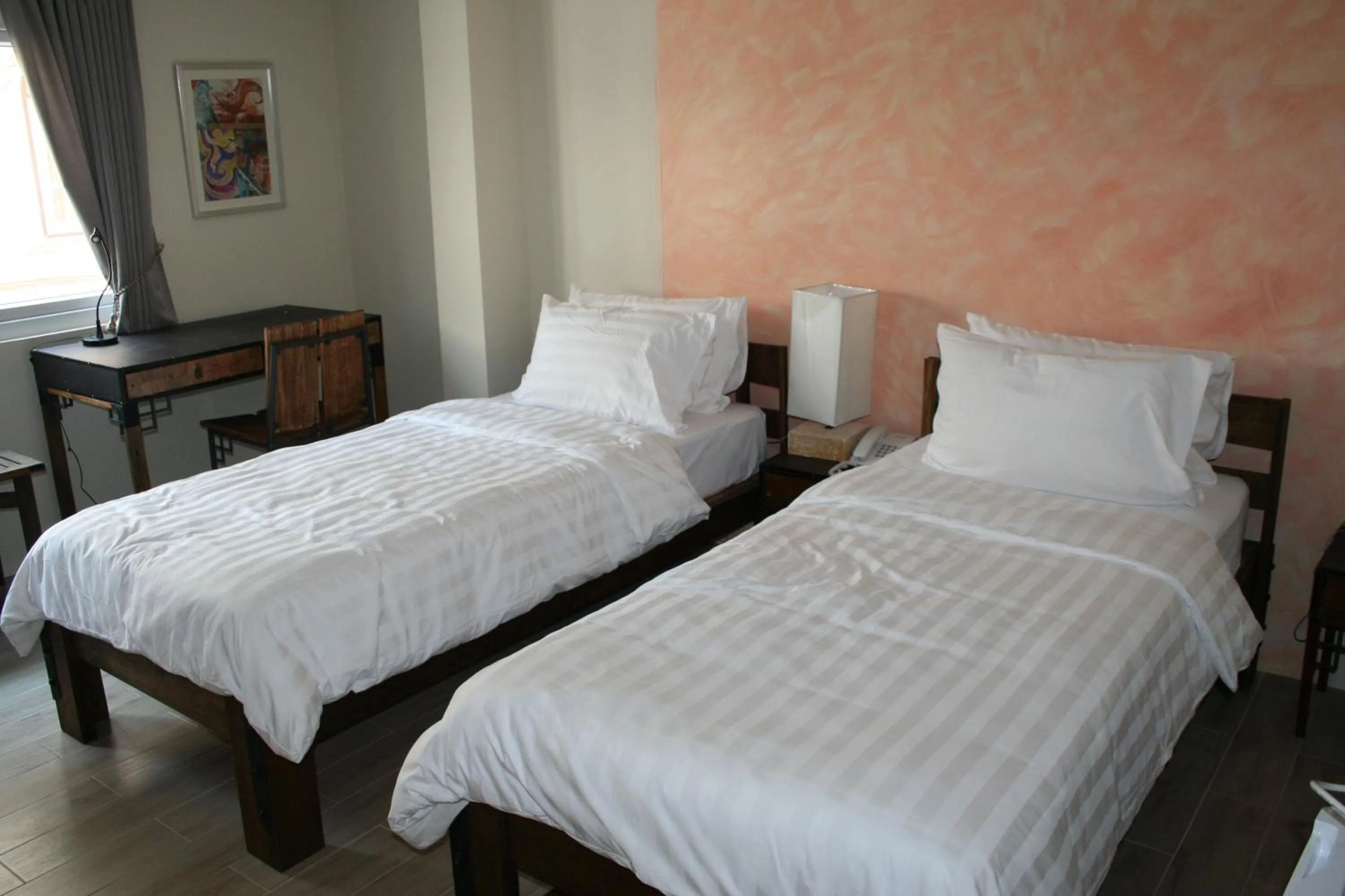 Bed in Arcadia Maephim Serviced Apartments