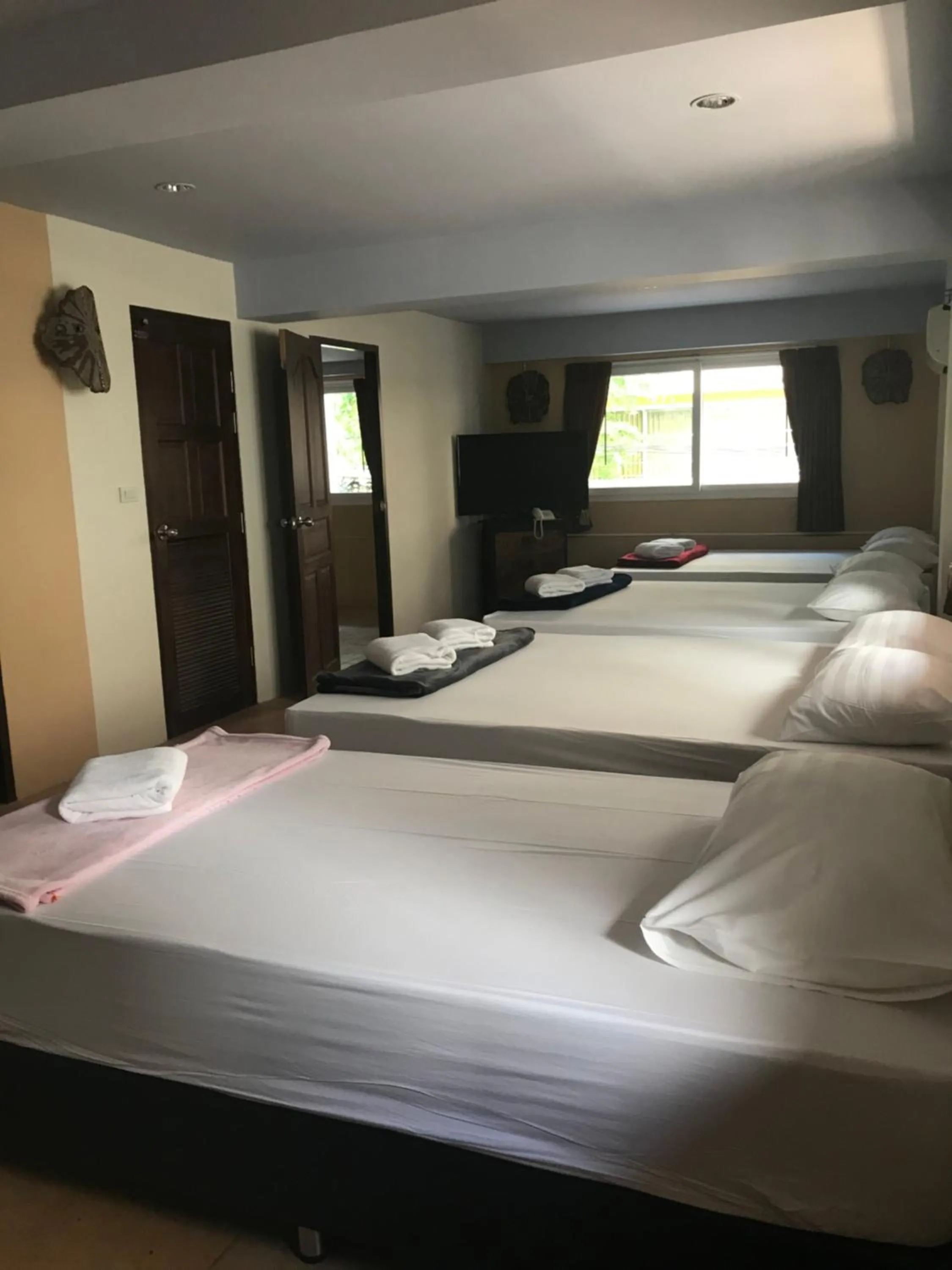 Bed in Arcadia Maephim Serviced Apartments