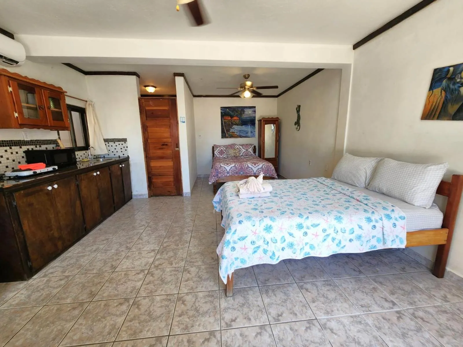 Bed in Beach Side Condos Caye Caulker by CCVH