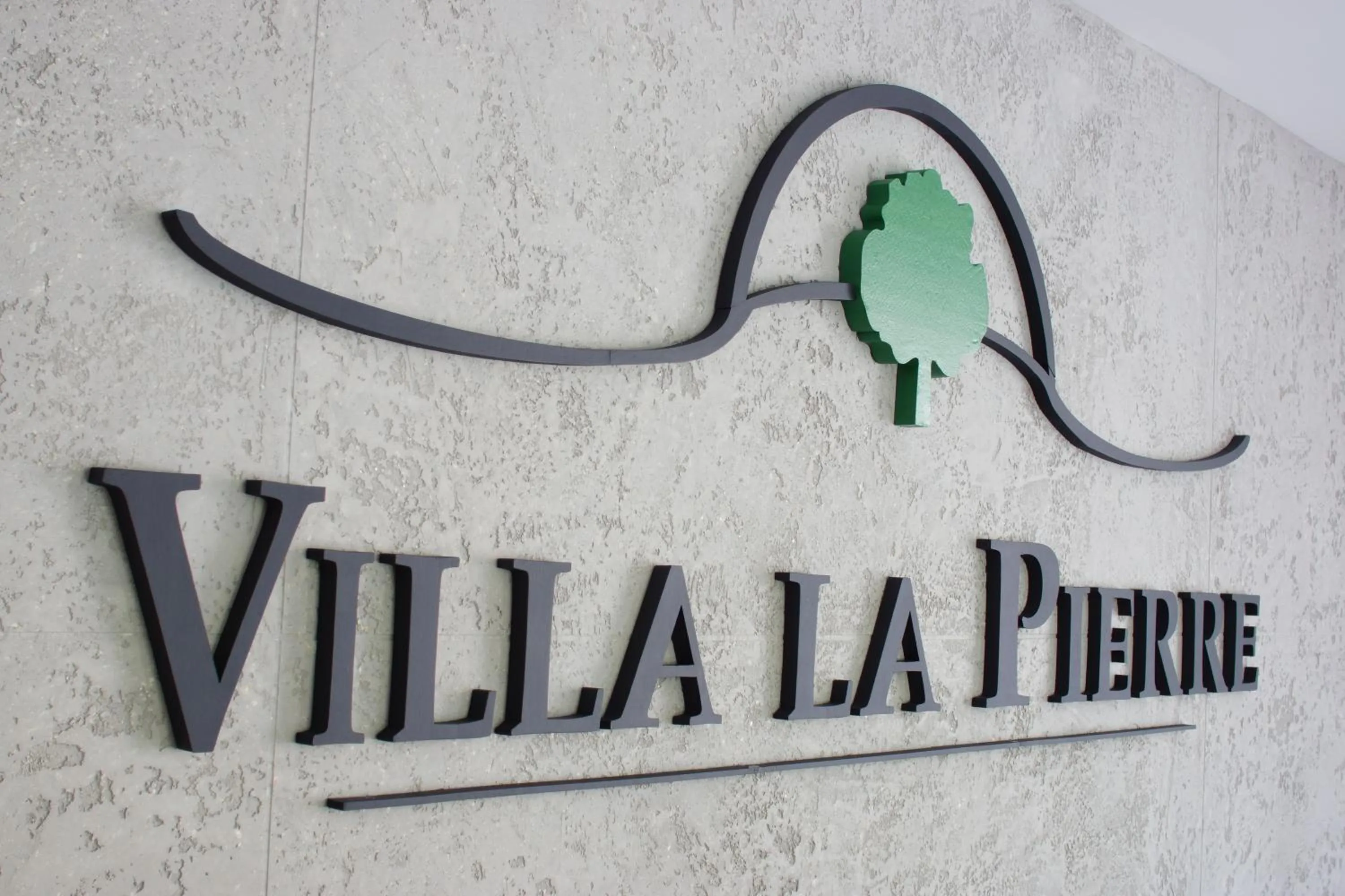 Property logo or sign in Villa La Pierre