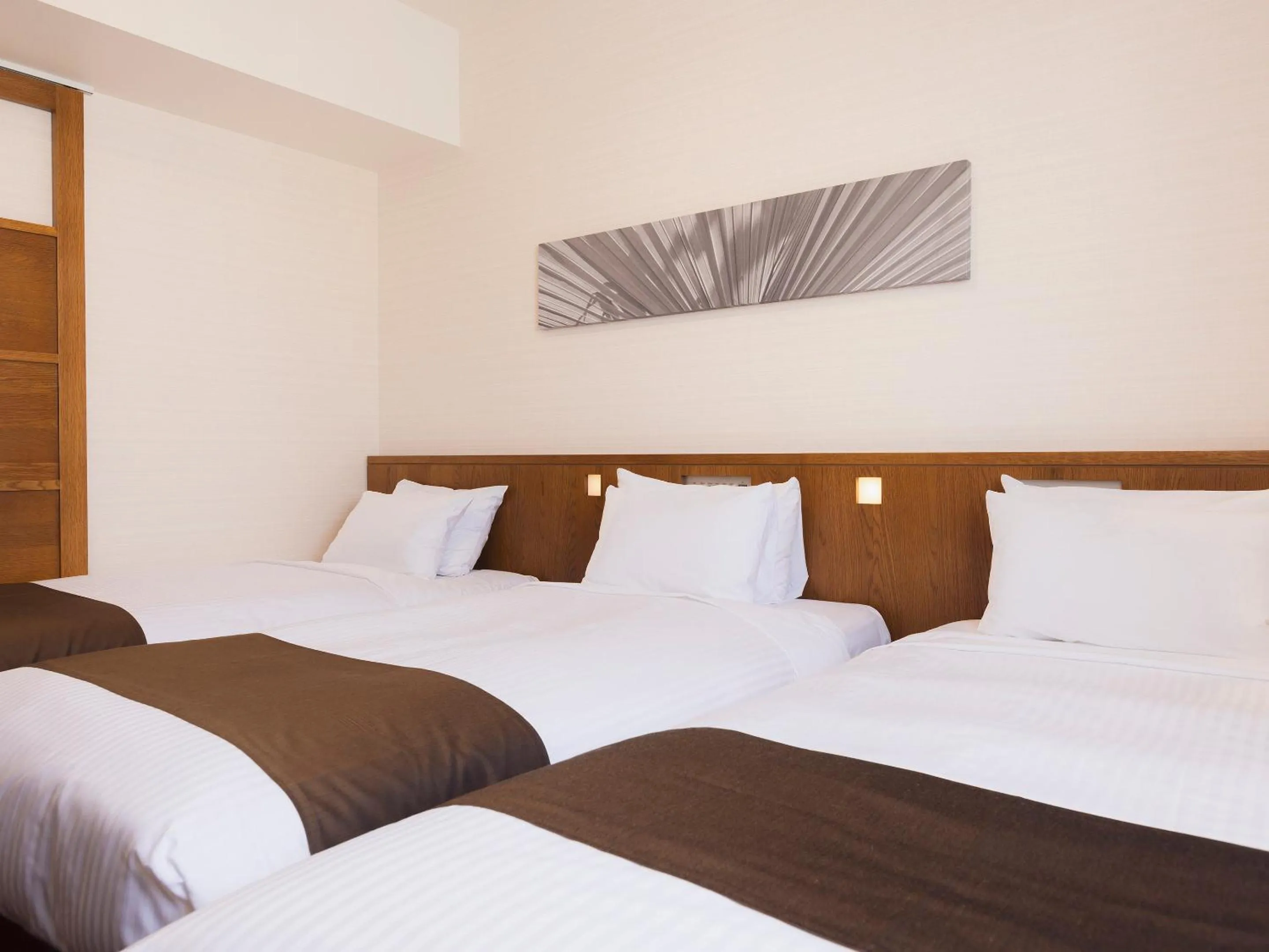 Bed in Hotel Gracery Naha