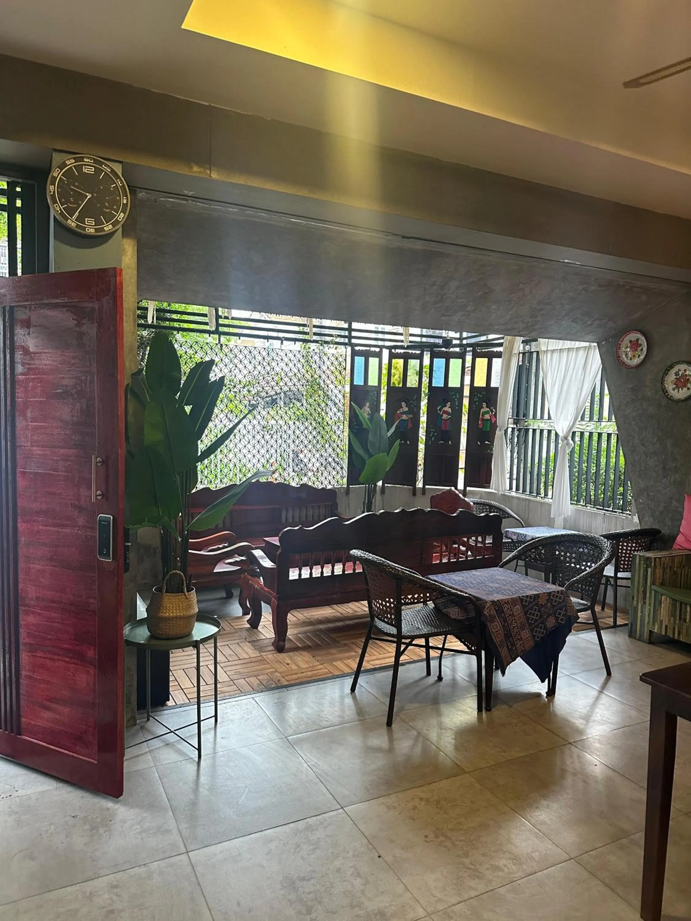 Seating area in SawasdeeCiao Patong Guesthouse