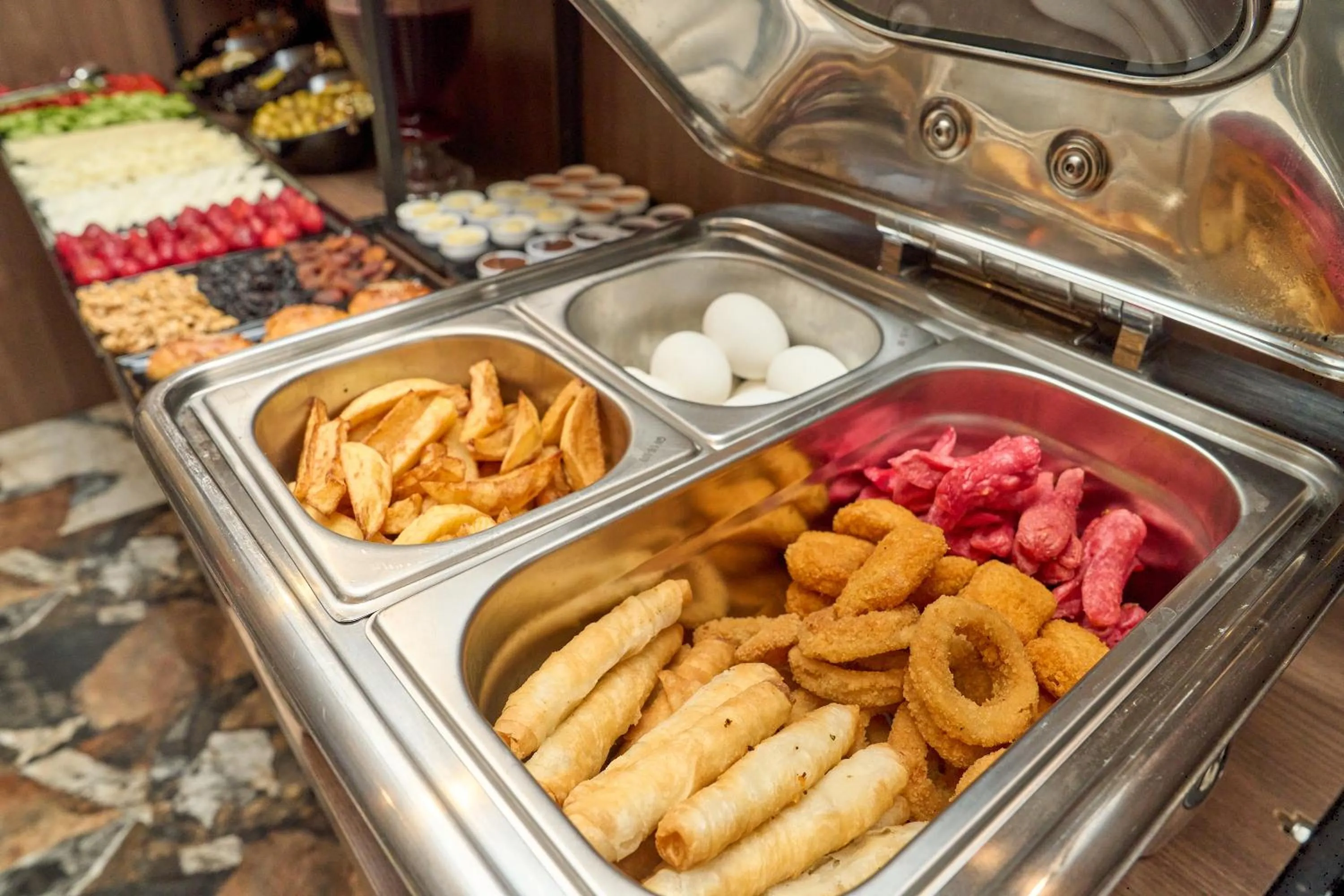 Buffet breakfast in Bonne Sante Hotel