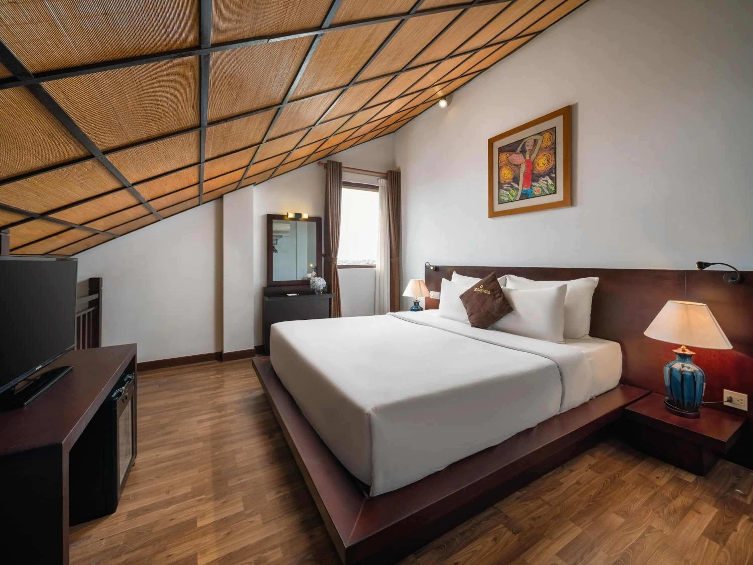 Communal lounge/ TV room, Bed in Hoi An Odyssey Hotel & Spa