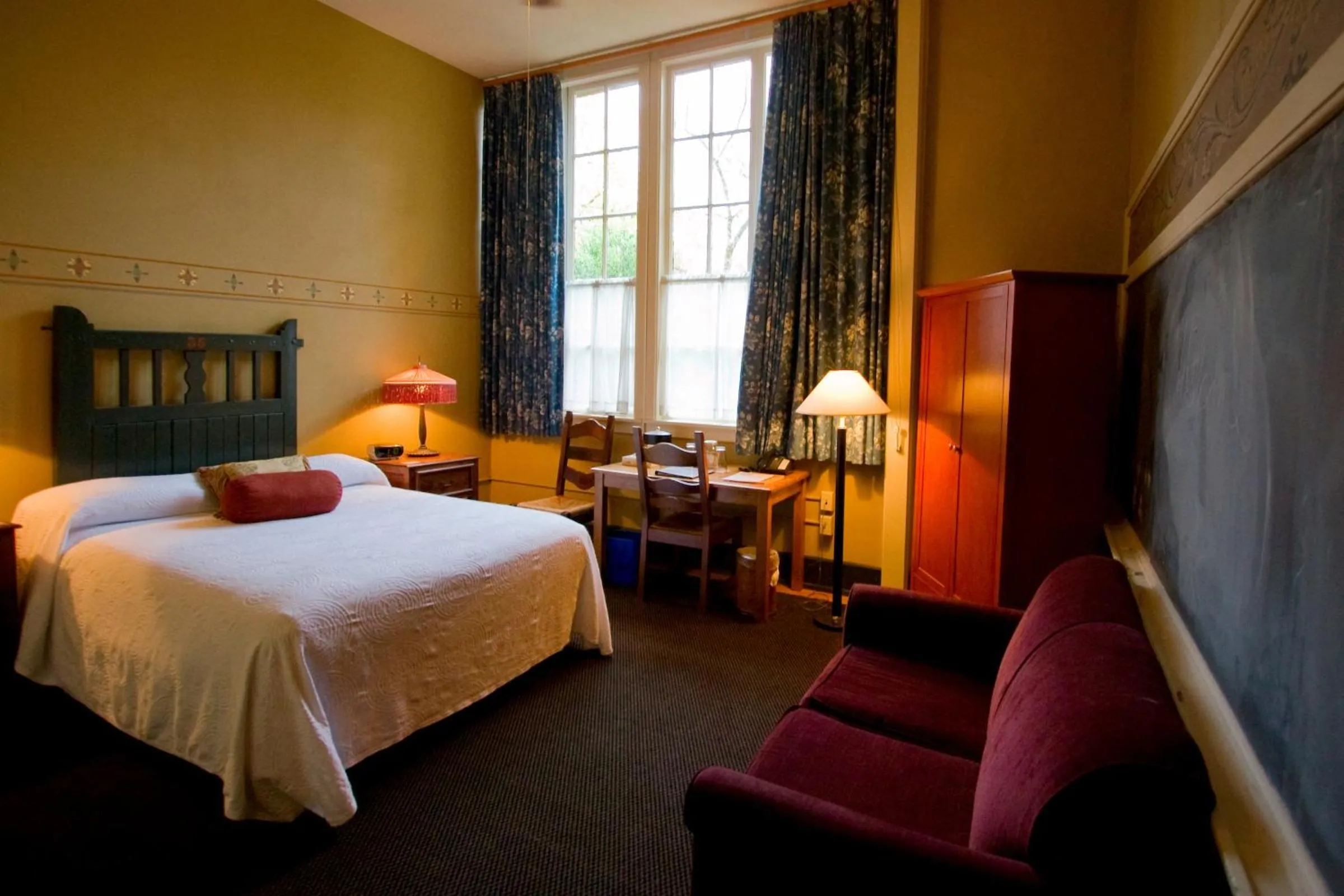 Seating area, Bed in McMenamins Kennedy School