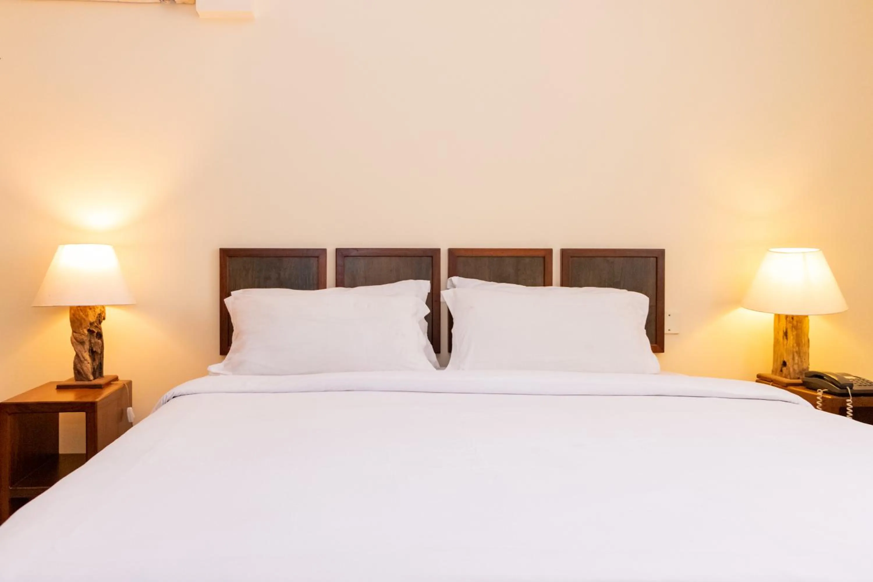 Bed in Royal Court Hotel