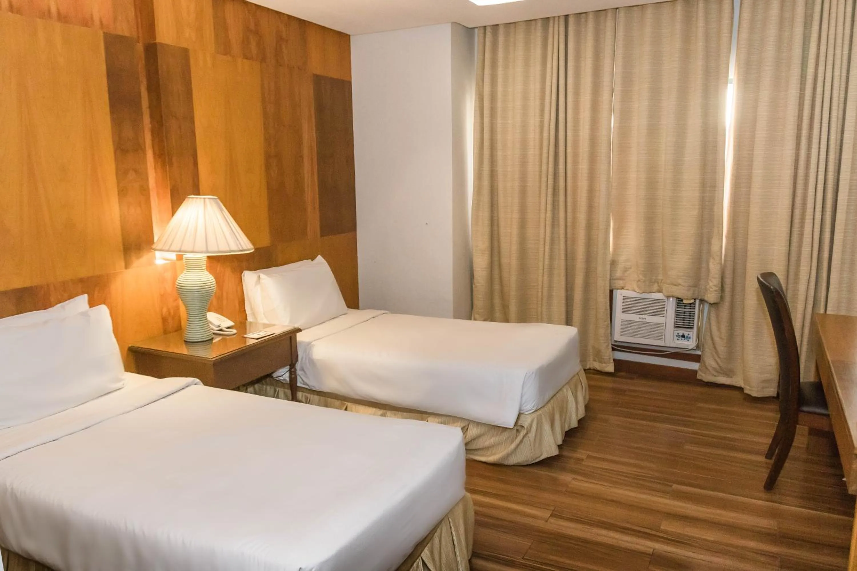 Bed in La Fiesta Hotel