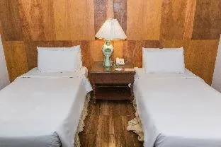 Bed in La Fiesta Hotel