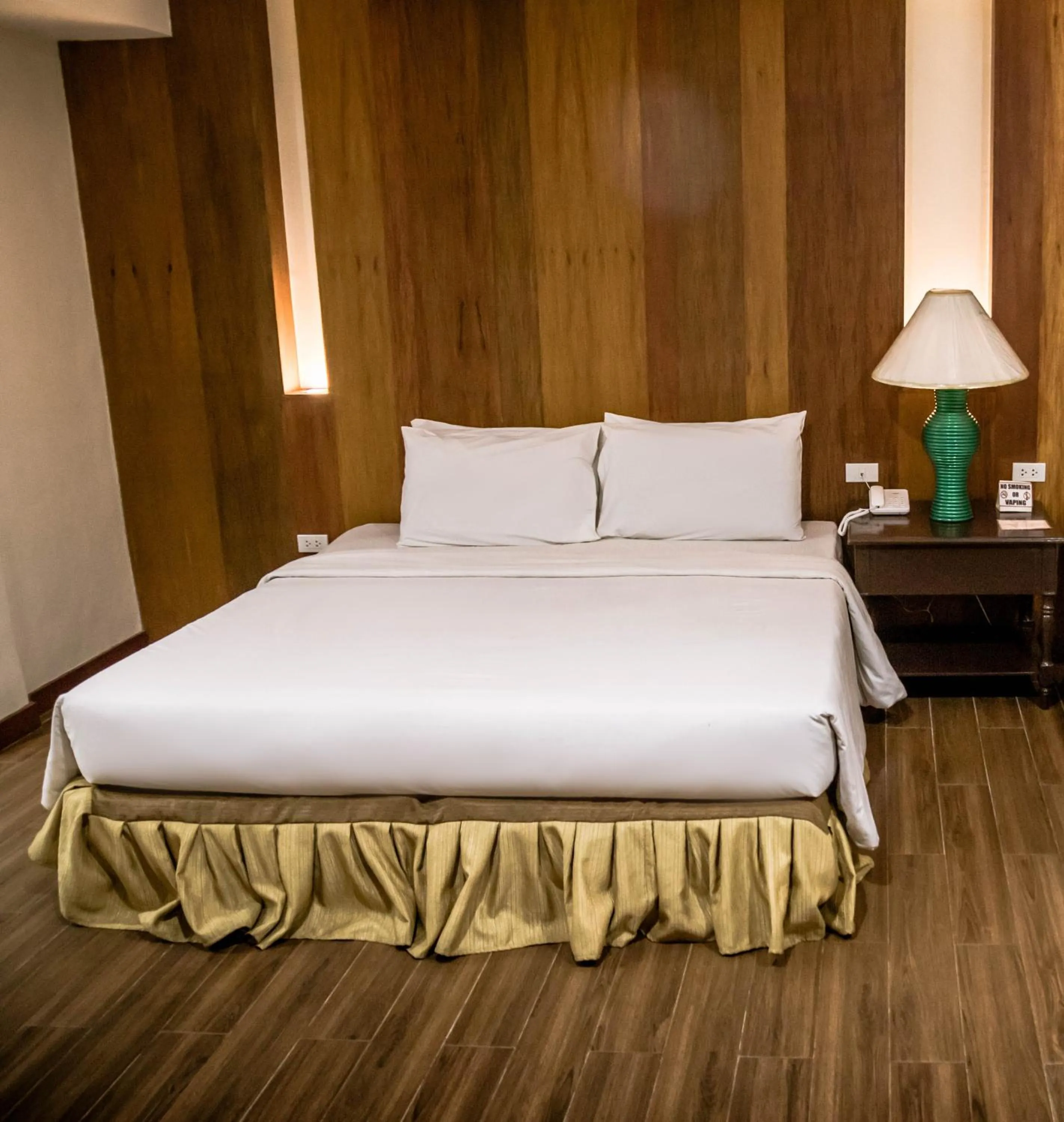 Bed in La Fiesta Hotel