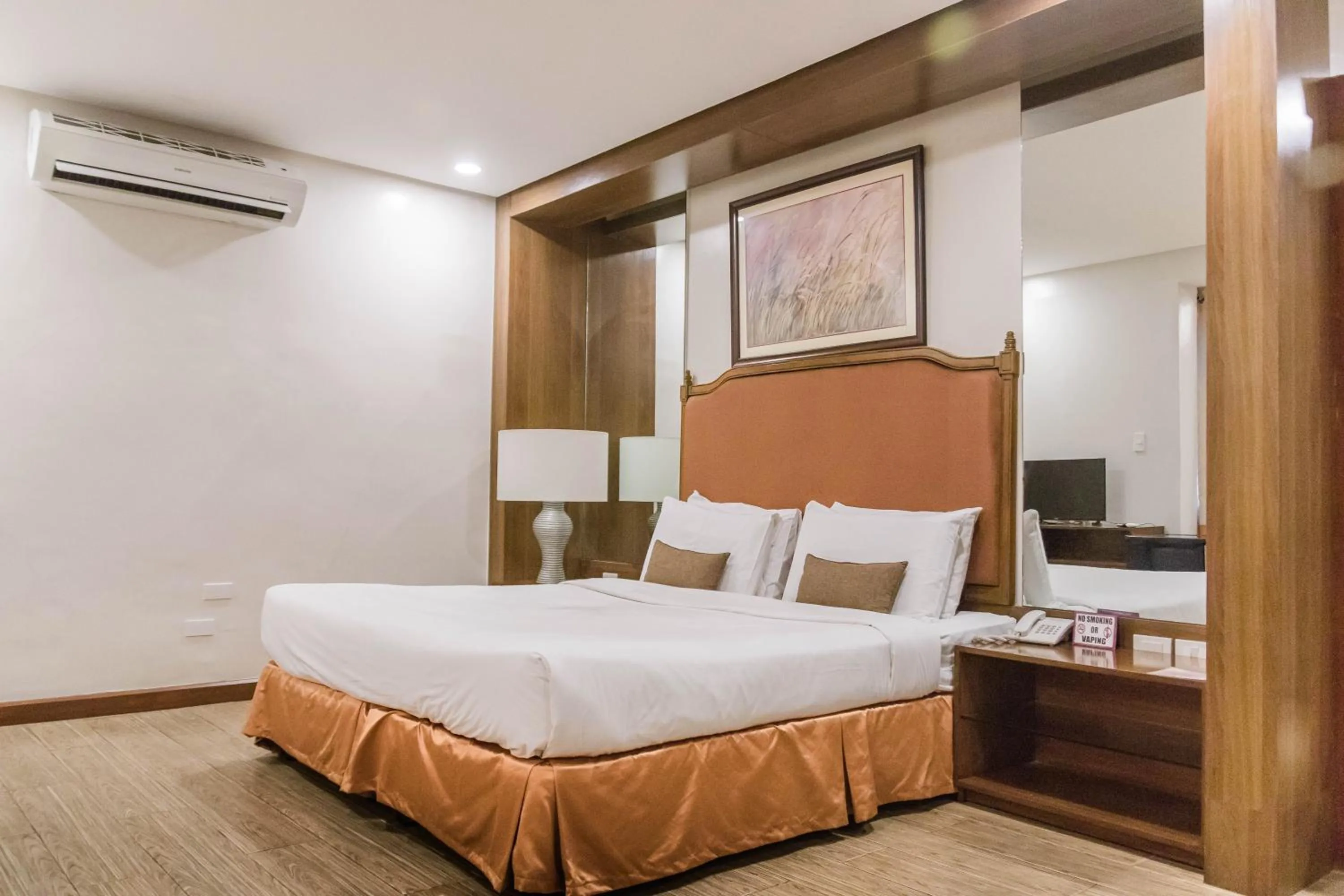 Bed in La Fiesta Hotel