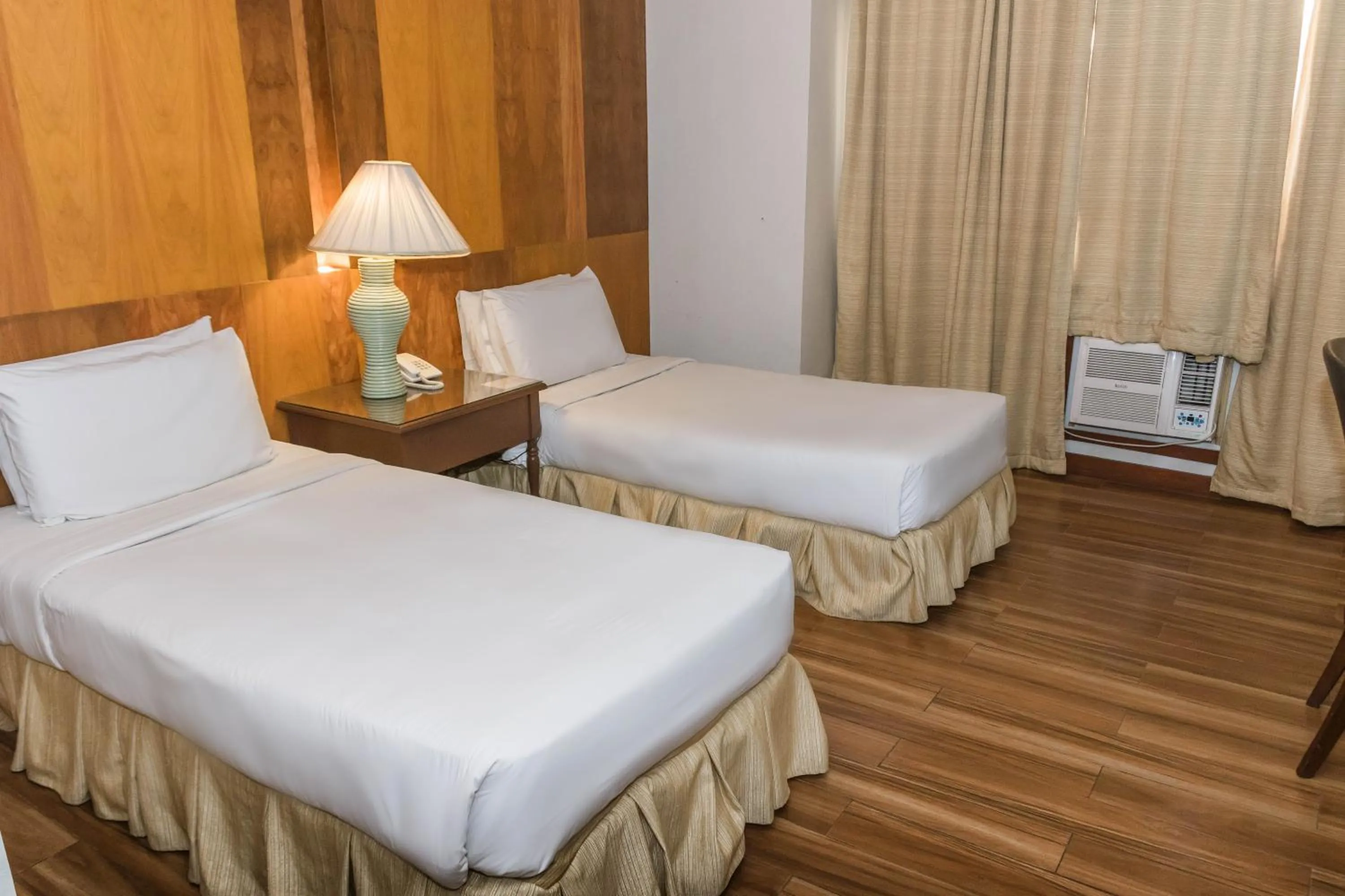 Bed in La Fiesta Hotel