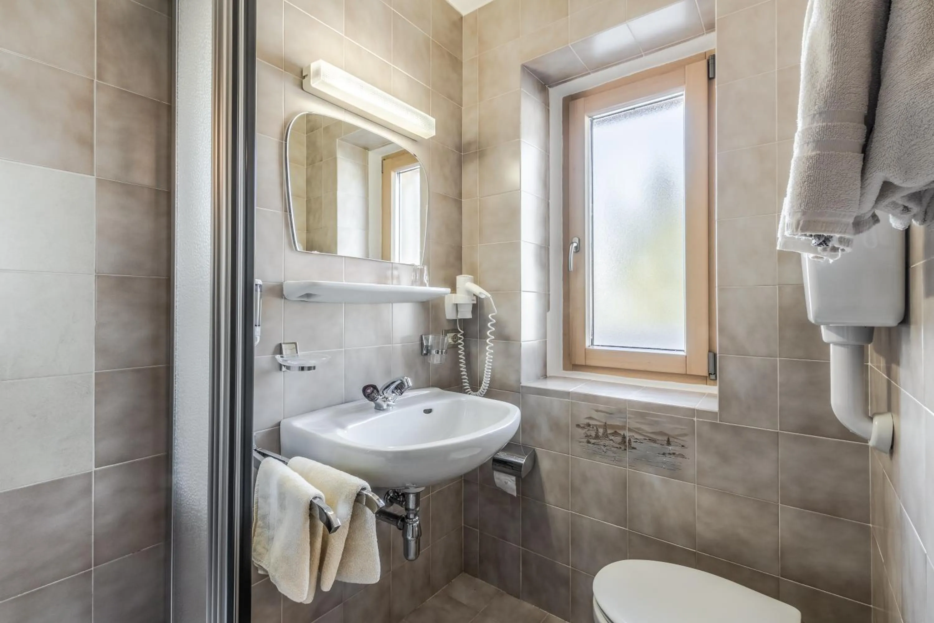 Bathroom in Garni Baita