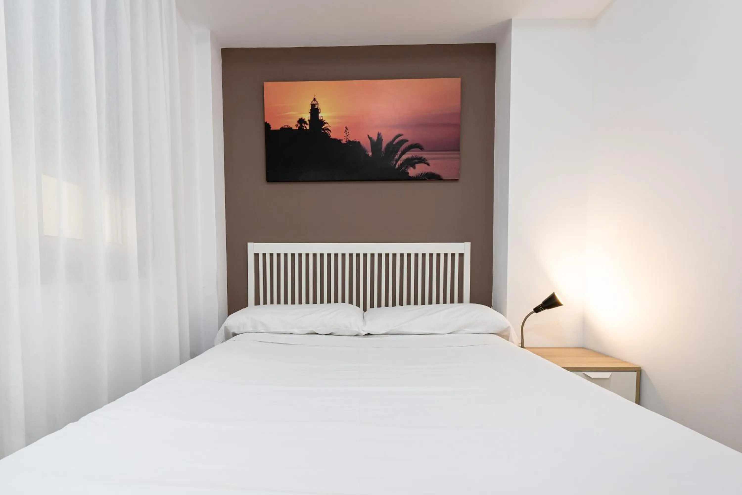 Bed in Neptuno Apartments