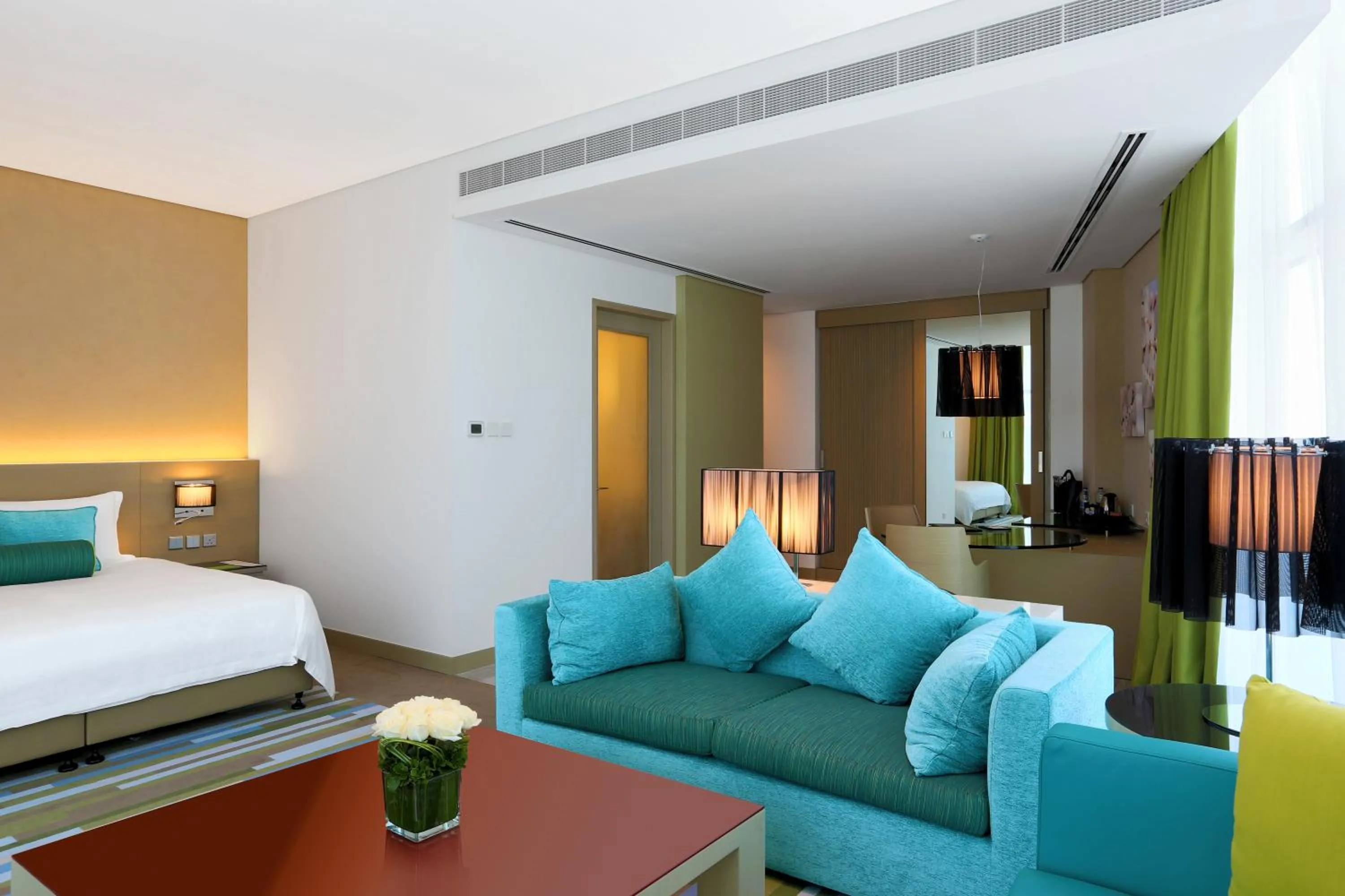 Seating area, Bed in Downtown Rotana