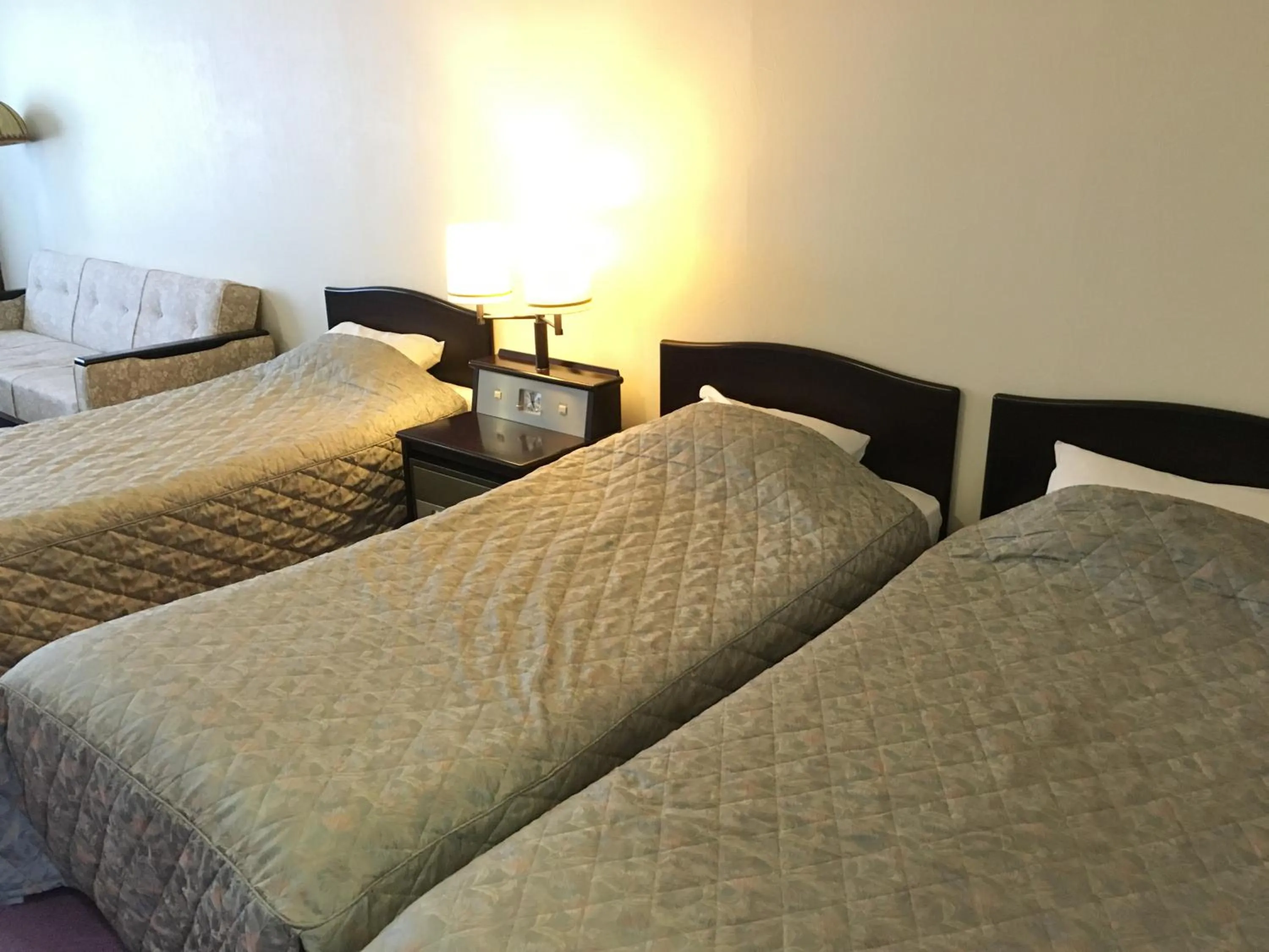 Bed in Nikko Astraea Hotel