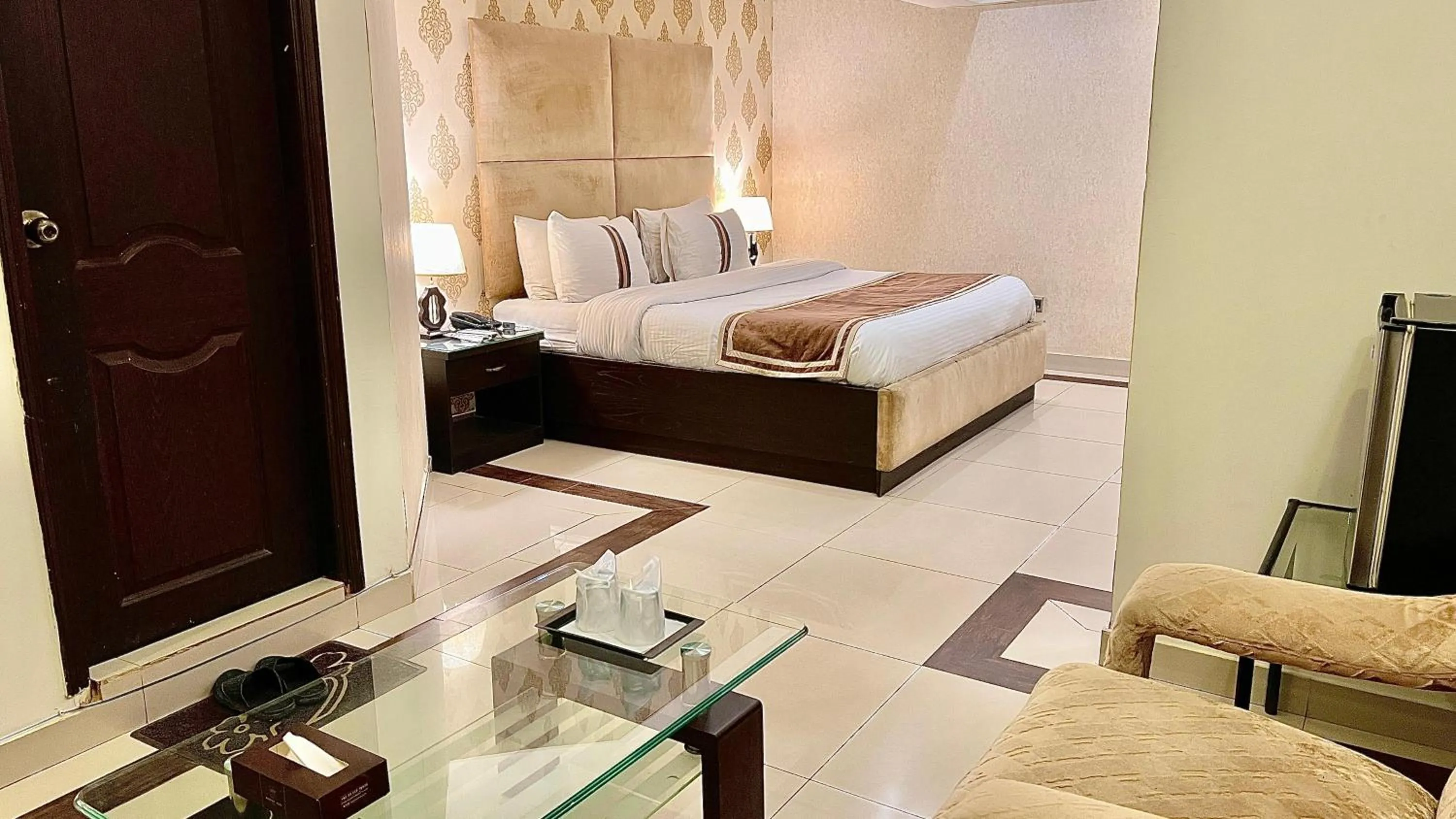 Bed in Royal Inn Hotel