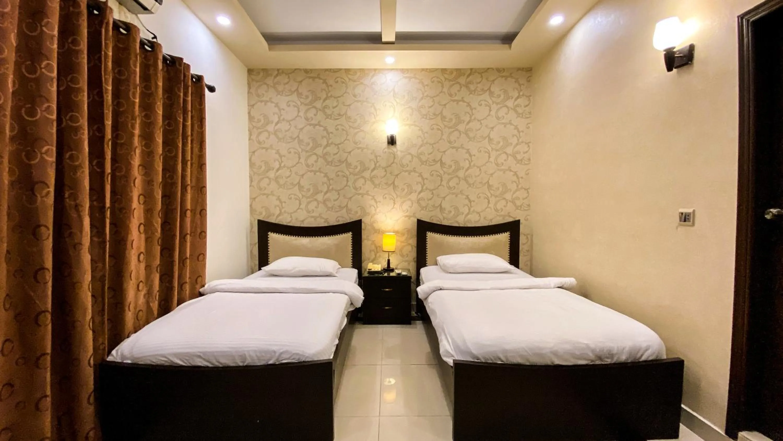 Bed in Royal Inn Hotel