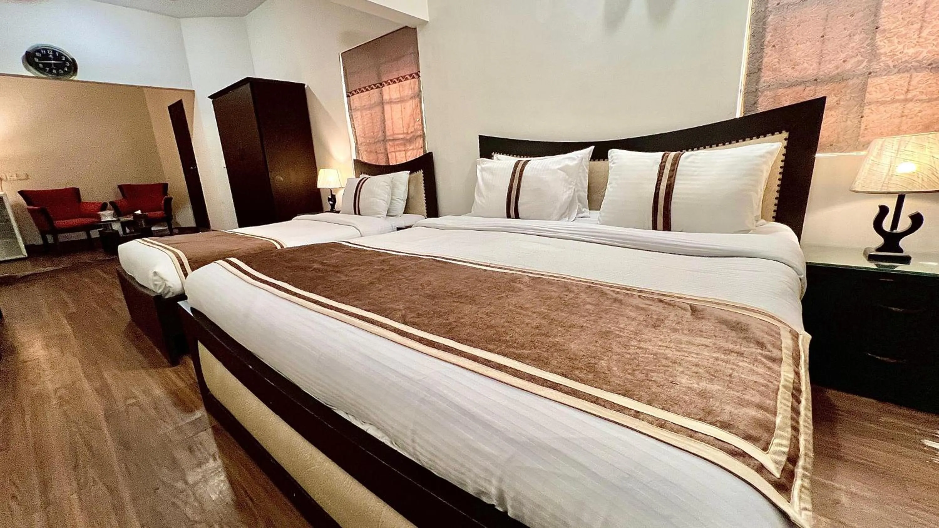 Bed in Royal Inn Hotel