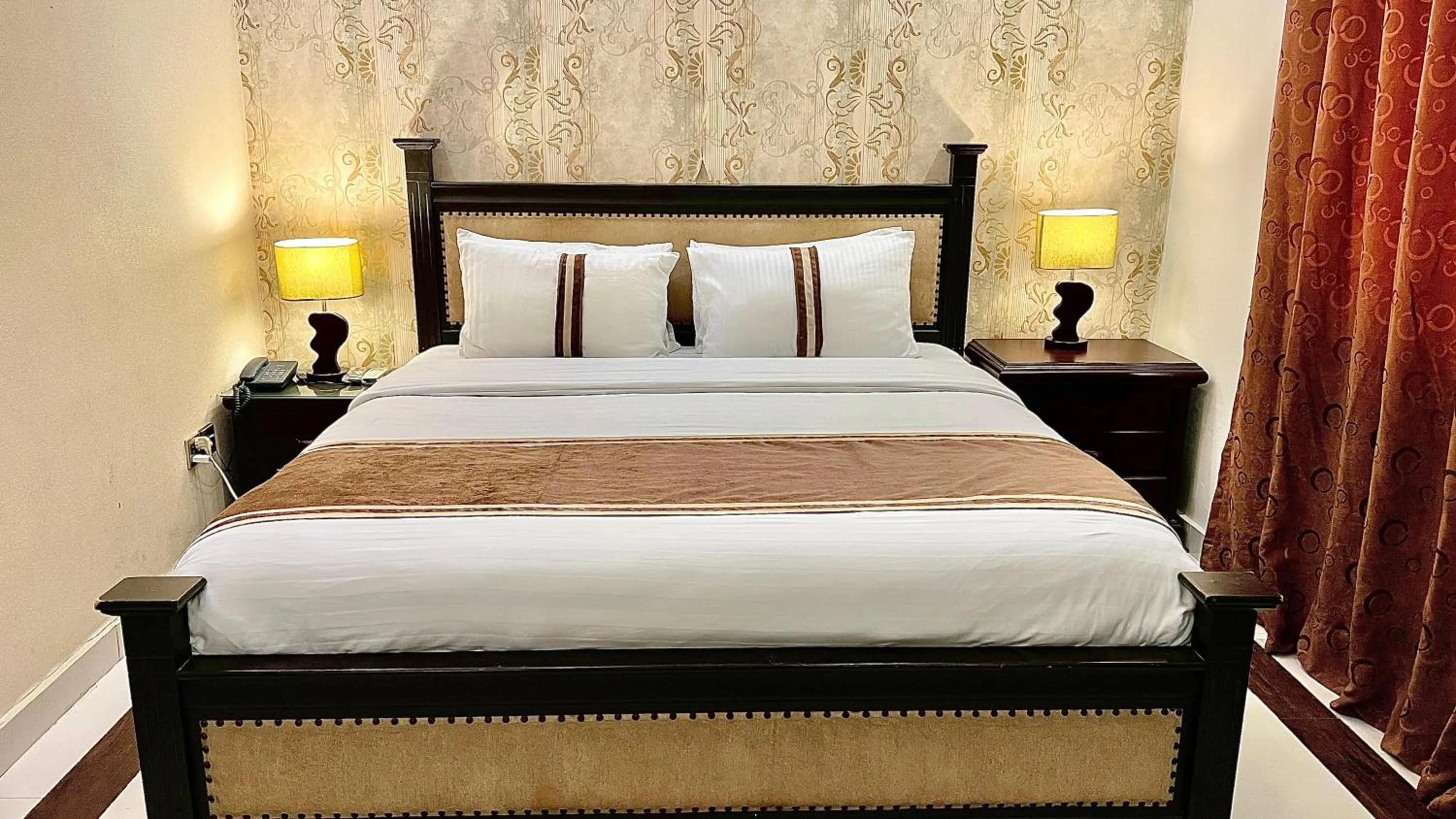 Bed in Royal Inn Hotel