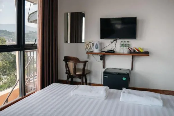 Bed in Riverside Houayxay Hotel