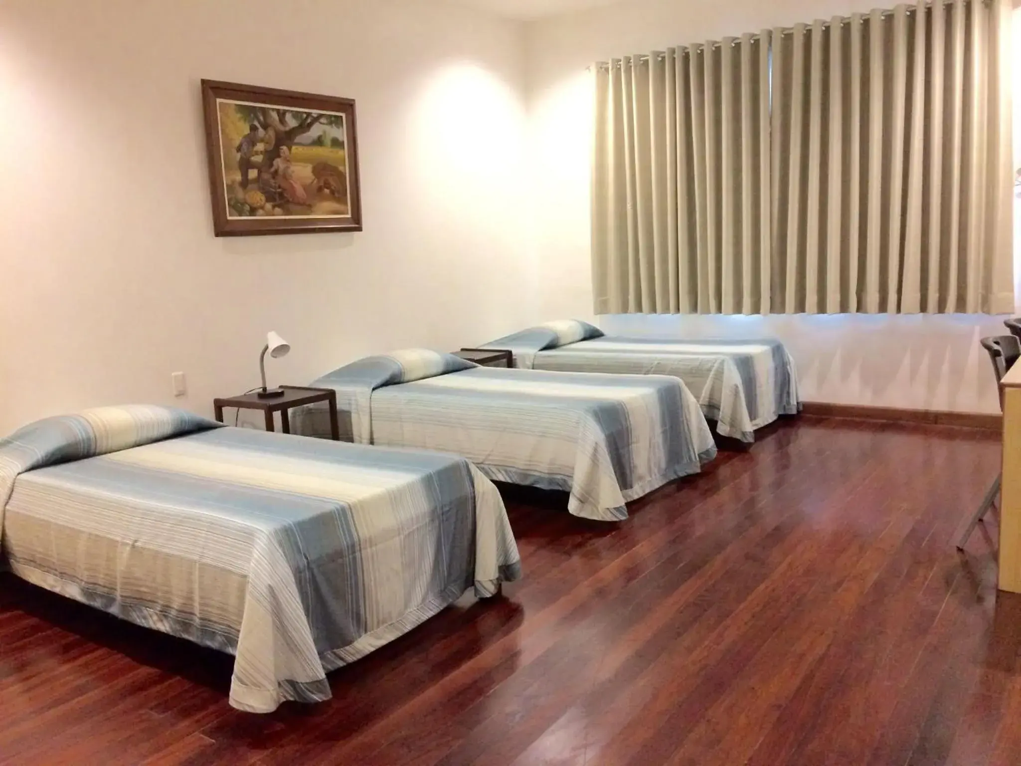 Basic Triple Room in Pension Natividad Basic Triple Room in Pension Natividad