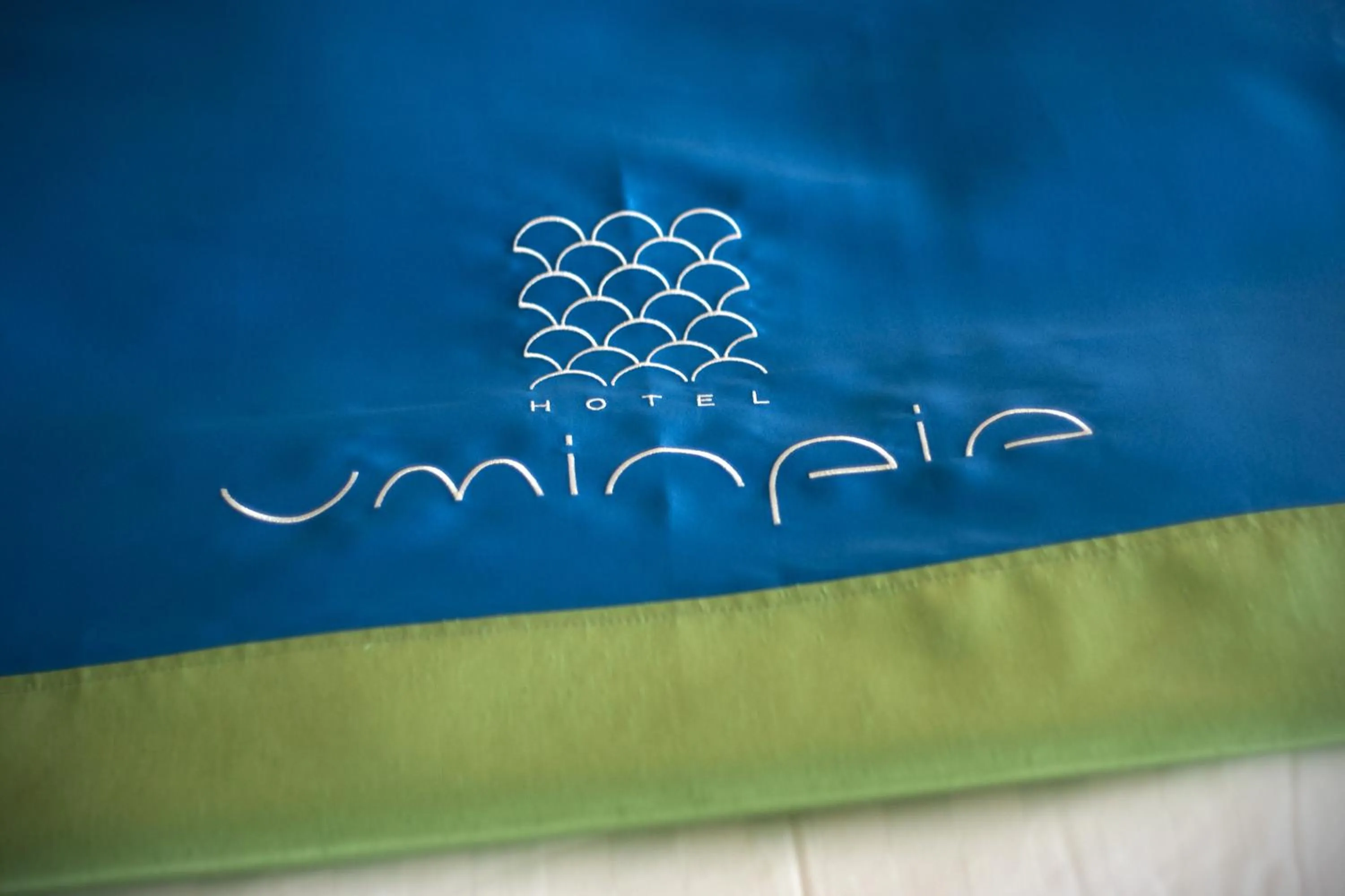 Property logo or sign in Uminpia