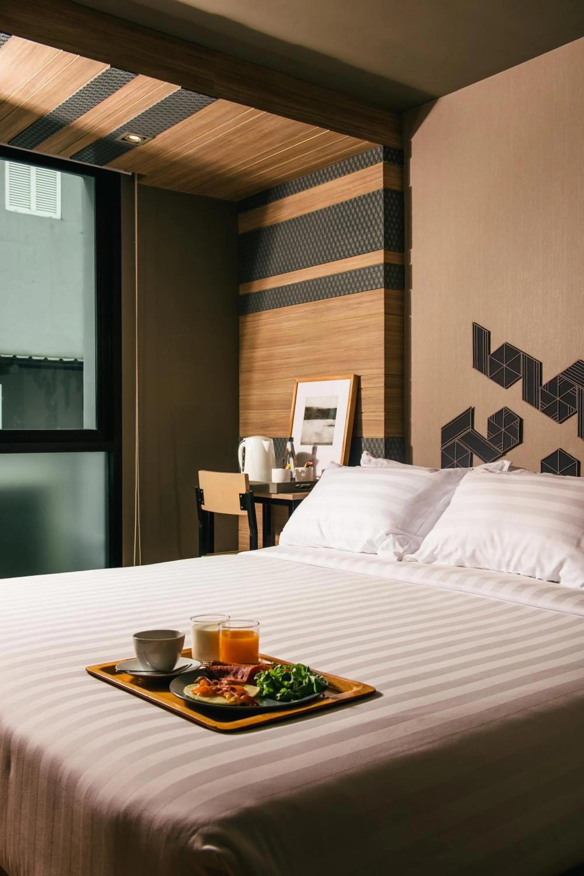 Bed in NAP Hotel Bangkok