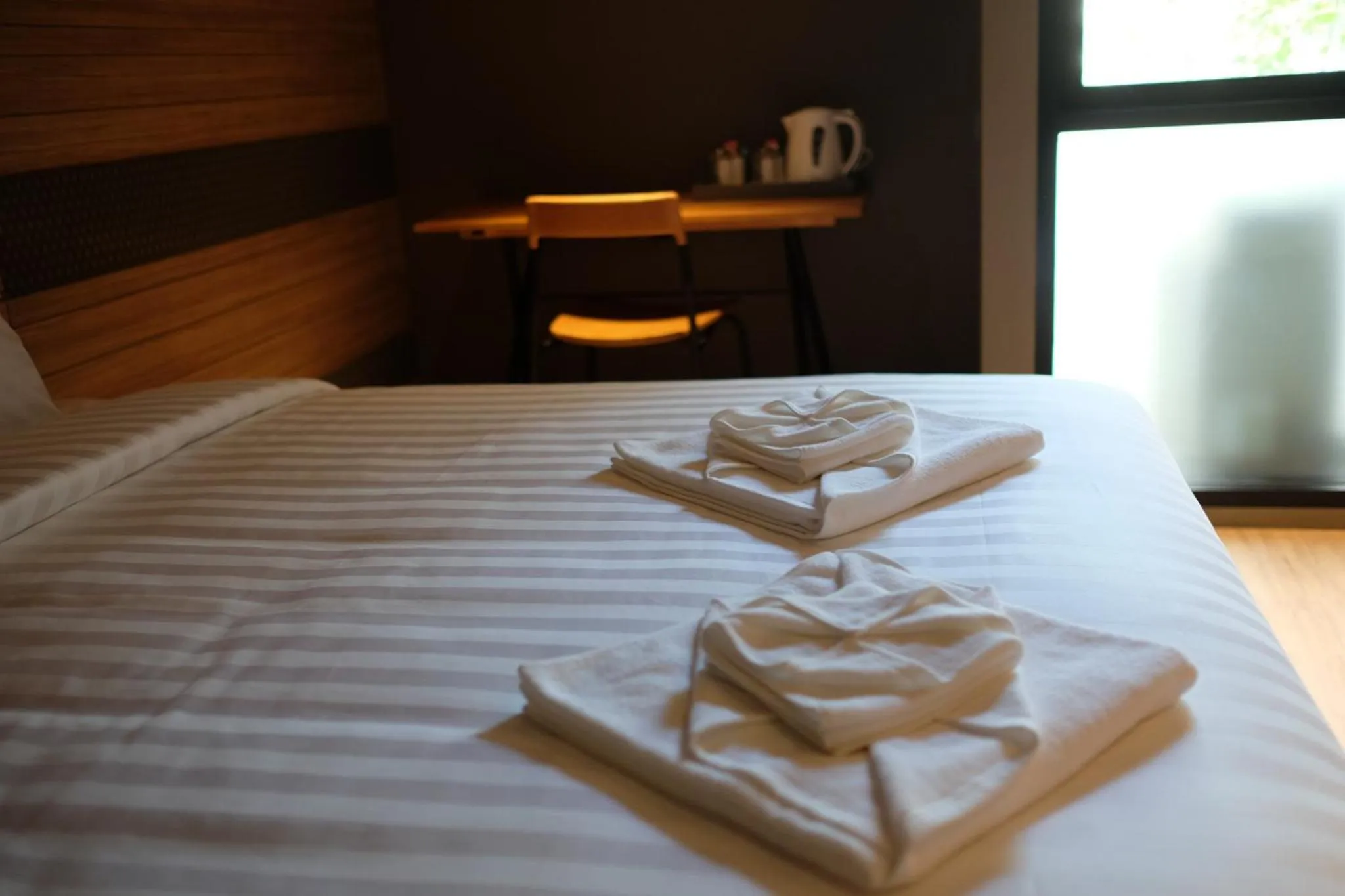 Bed in NAP Hotel Bangkok