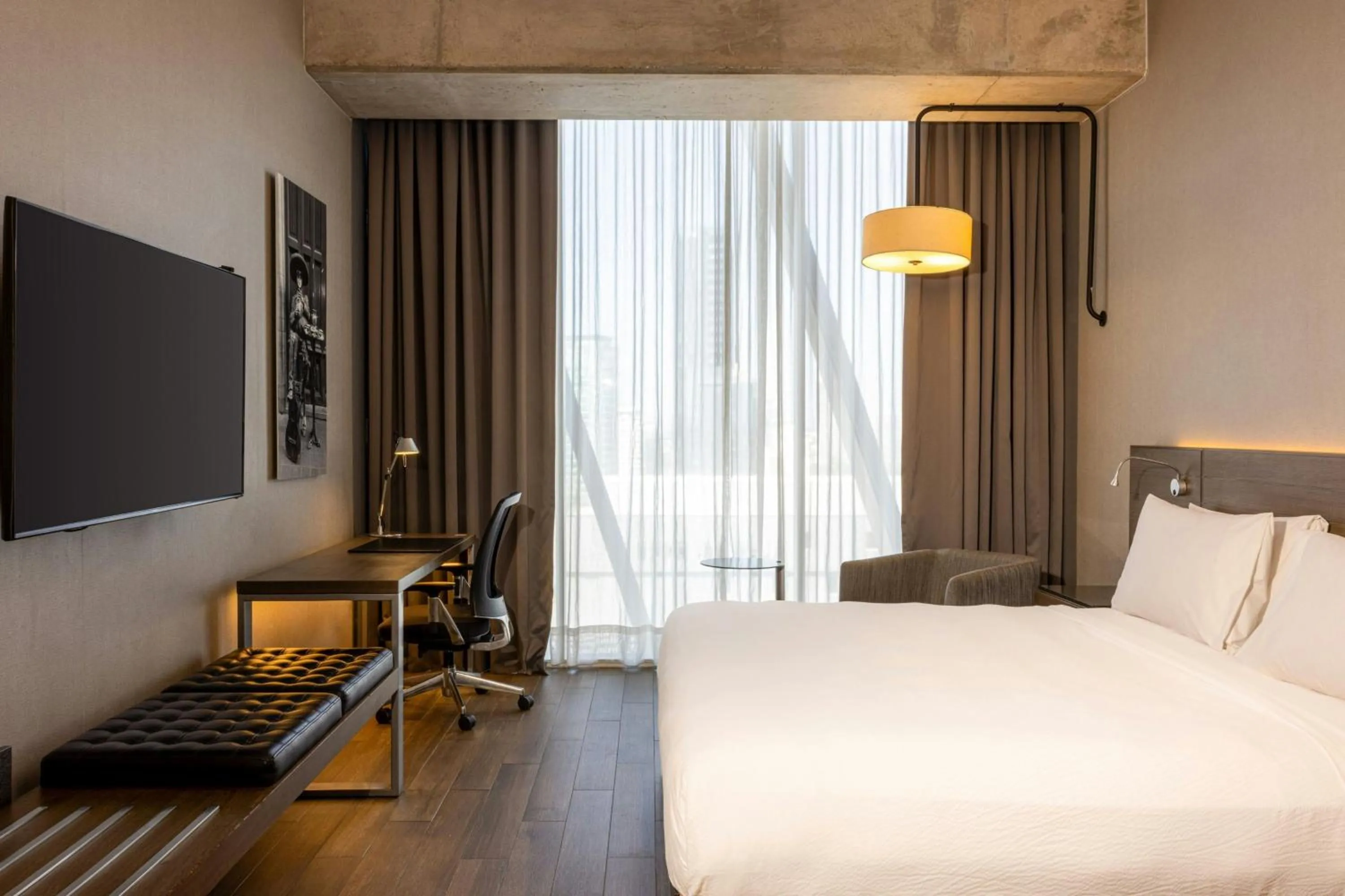 Photo of the whole room, Bed in AC Hotel by Marriott Guadalajara Mexico