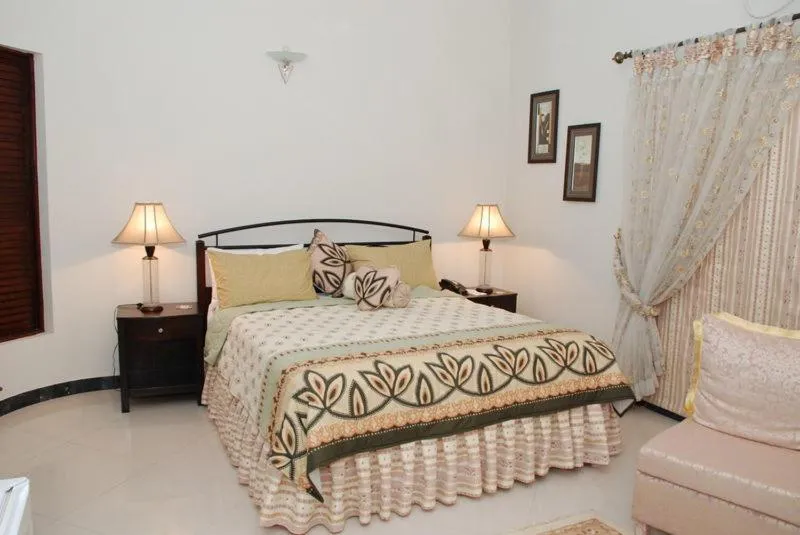 Photo of the whole room, Bed in Savoy Inn Guest House Islamabad